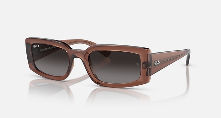 Brown square sunglasses with dark brown lenses and clear temple tips