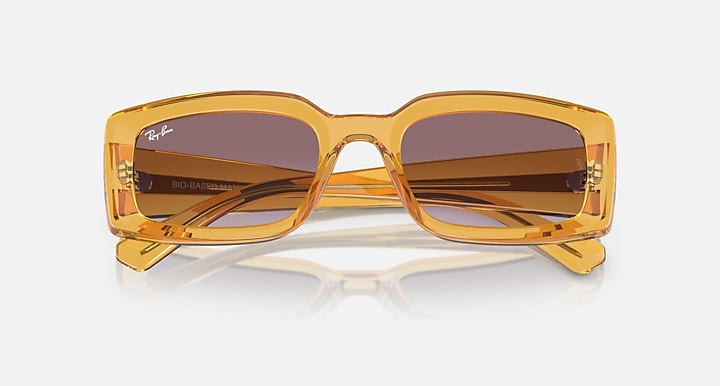 Ray-Ban Kiliane RB4395 sunglasses, amber frame with dark gradient lenses and top bar
