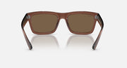 Transparent brown rectangular sunglasses with brown lenses and metal accents.