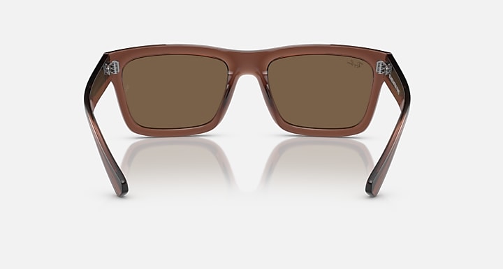 Transparent brown rectangular sunglasses with brown lenses and metal accents.
