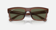 Transparent brown sunglasses with dark green lenses and Bio-based markings, front