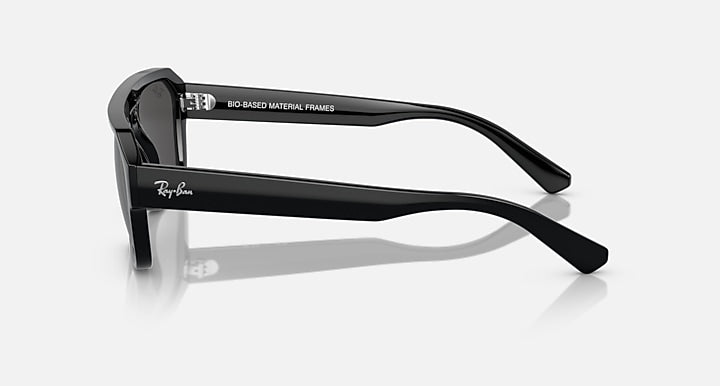 Rectangular sunglasses, black frame with dark lenses and extended temple arms