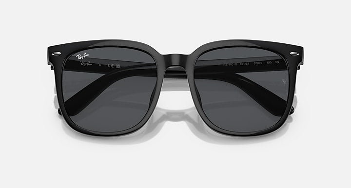 Black sunglasses with dark grey mirrored lenses and wide bridge