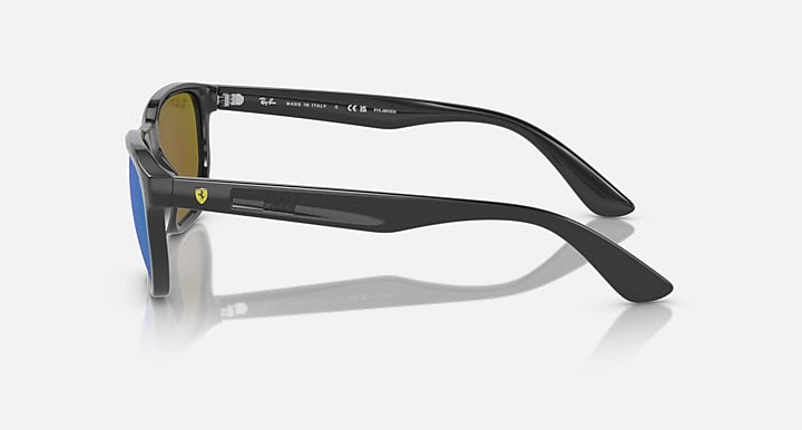 Ray-Ban RB4404M sunglasses, side view of black frames with blue mirrored lenses