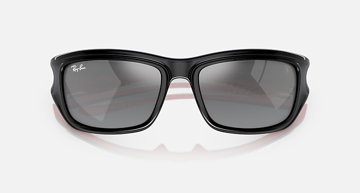 Black sunglasses with dark grey gradient lenses and rounded-rectangular frame