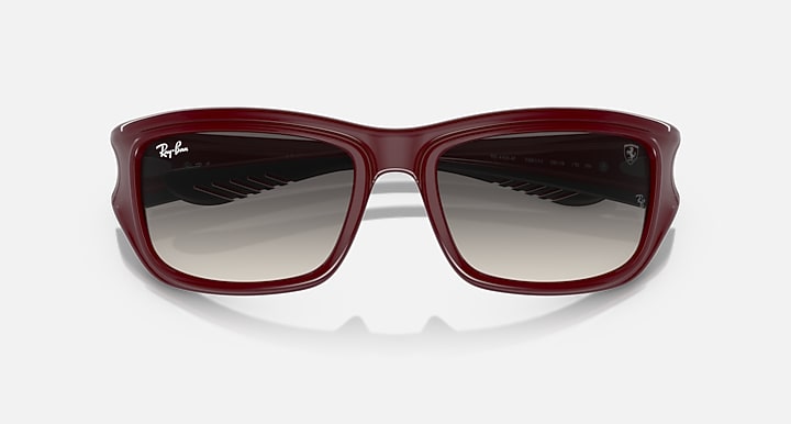 Dark red sunglasses with dark gradient lenses, top view