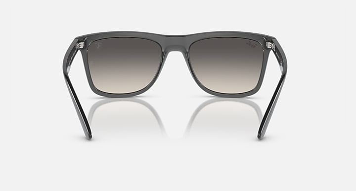 Front view dark gray wayfarer sunglasses with gradient smoke lenses and metal hinges.
