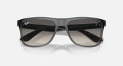 Overhead/front dark gray wayfarer sunglasses with gradient smoke lenses and frame cutouts.
