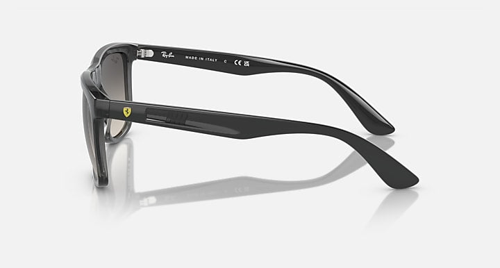 Side profile dark gray wayfarer sunglasses with metal hinge and temple branding.