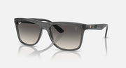 Dark gray wayfarer sunglasses with gradient smoke lenses; Ray-Ban logo on temple.