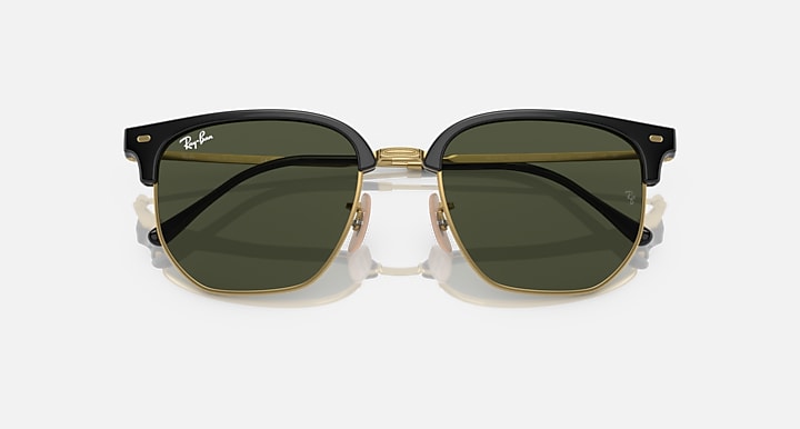 Ray-Ban Clubmaster sunglasses front view with black frames, gold rims, dark smoke lenses