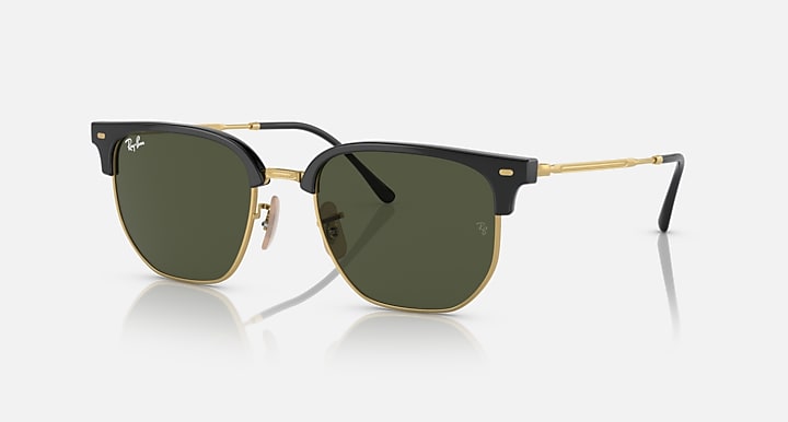 Ray-Ban Clubmaster sunglasses with black frames, gold accents, dark green lenses