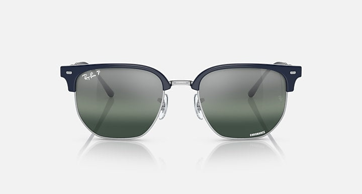 Ray-Ban Clubmaster sunglasses with dark green lenses and navy rectangular frame