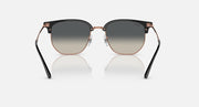 Clubmaster sunglasses front view, dark gray lenses and black frame with rose-gold details