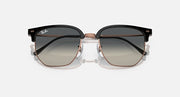 Clubmaster sunglasses with dark gray gradient lenses and black frame, rose-gold temples