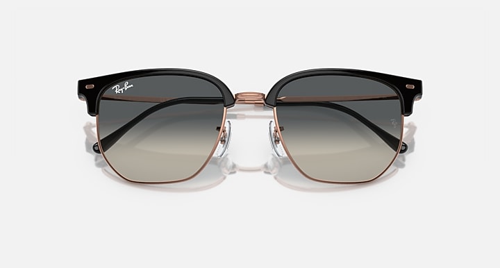 Clubmaster sunglasses with dark gray gradient lenses and black frame, rose-gold temples