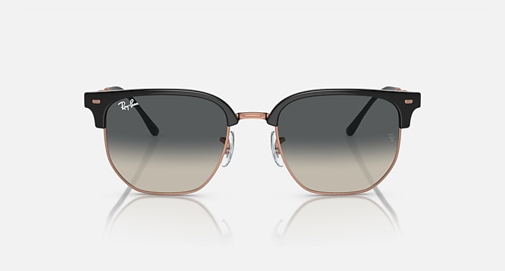 Clubmaster sunglasses with dark gray lenses and black frame, rose-gold metal bridge