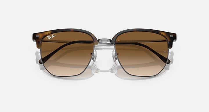 Ray-Ban Clubmaster sunglasses with brown gradient lenses and dark tortoise frame