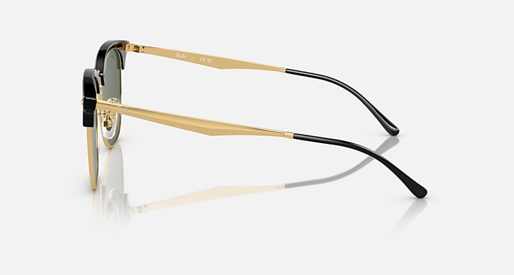 Ray-Ban RB4418D sunglasses, side profile, dark green lenses, black frame with gold arms