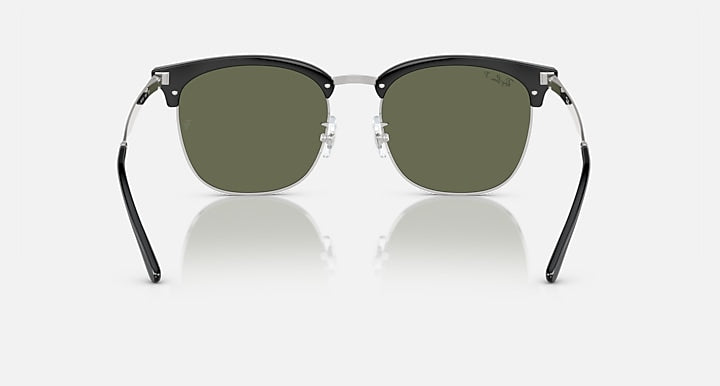 Ray-Ban RB4418D sunglasses, front view, dark green lenses, black frame with silver bridge