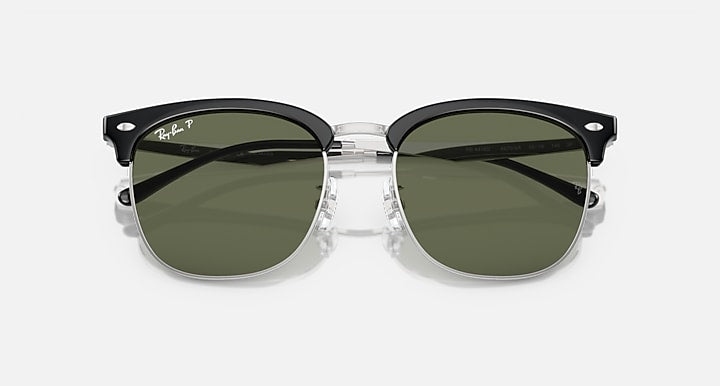 Ray-Ban RB4418D sunglasses, close front, dark green lenses, black frames with metal bridge