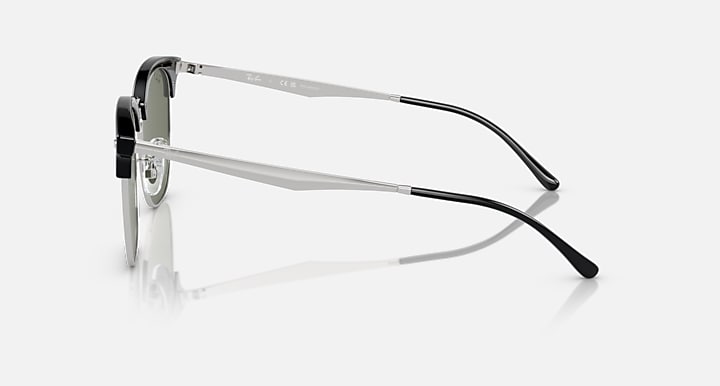 Ray-Ban RB4418D sunglasses, side profile, dark green lenses, clear-to-silver arms and tips