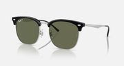 Ray-Ban RB4418D sunglasses, angled view, dark green polarized lenses, black frames with silver arms