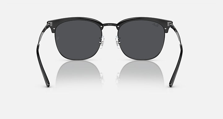 Ray-Ban RB4418D round sunglasses with dark gray lenses and black frame, front view