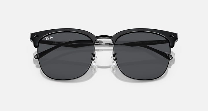 Ray-Ban RB4418D round sunglasses with black frame and dark gray lenses, close front