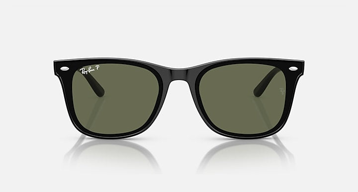 Black rounded sunglasses with green-tinted lenses, front view