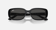 Black Ray-Ban sunglasses with dark wrap lenses and centered bridge detail
