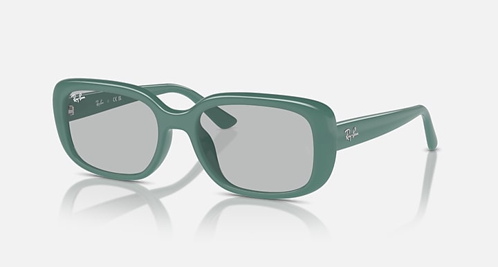 Green Ray-Ban sunglasses with light gray lenses and translucent glossy frame
