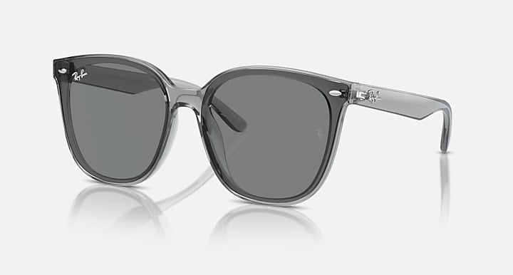 Sunglasses with transparent gray frames and dark gray lenses, front view