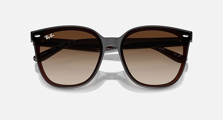 Dark brown square sunglasses with gradient brown lenses, top angled view