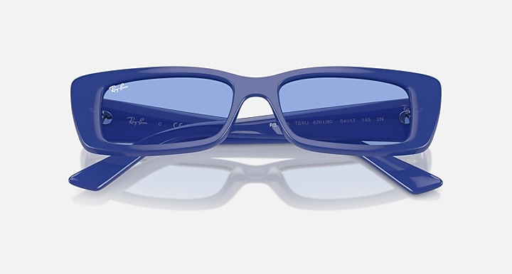 Blue rectangular sunglasses with light-blue lenses, top view showing inner markings