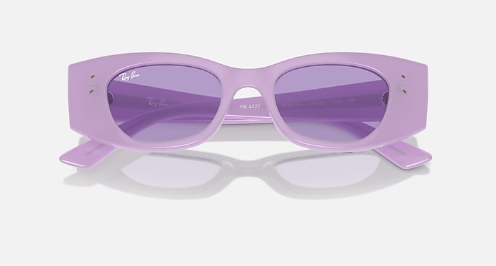 Lilac sunglasses with purple tinted lenses and visible logo details