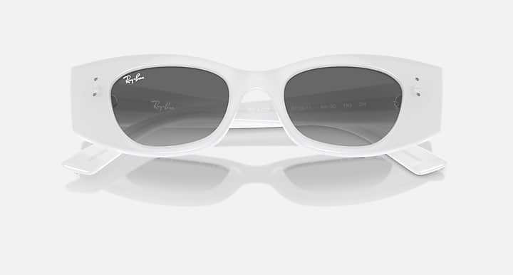 White sunglasses with dark lenses, center keyhole bridge, and extended temple detail