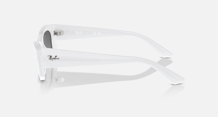 White sunglasses side profile with curved temples and dark lens edge view