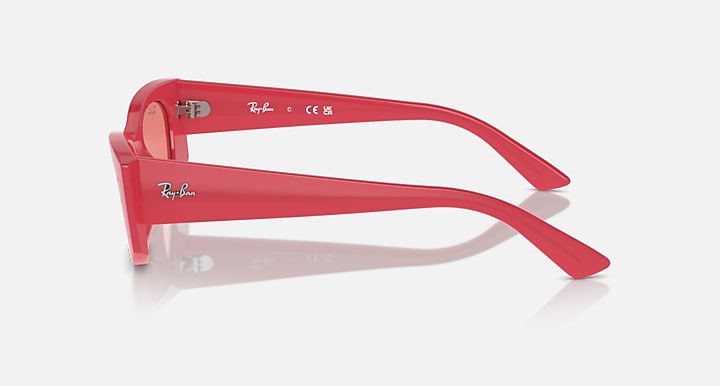 Red sunglasses side view with pink lenses, curved temples, and small hinge details
