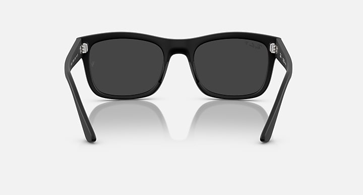 Ray-Ban RB4428 sunglasses, black frame and dark lenses, front view with temples visible