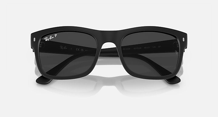 Ray-Ban RB4428 sunglasses, black frame and dark lenses, top-down centered view