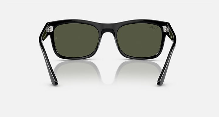 Ray-Ban RB4428 sunglasses from front, black frame with dark green lenses and metal accents