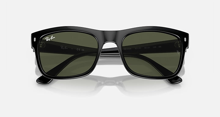 Ray-Ban RB4428 sunglasses front view, dark lenses in black frame with hinge details