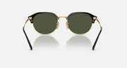 Round sunglasses with black frame, gold rim, and dark green tinted lenses