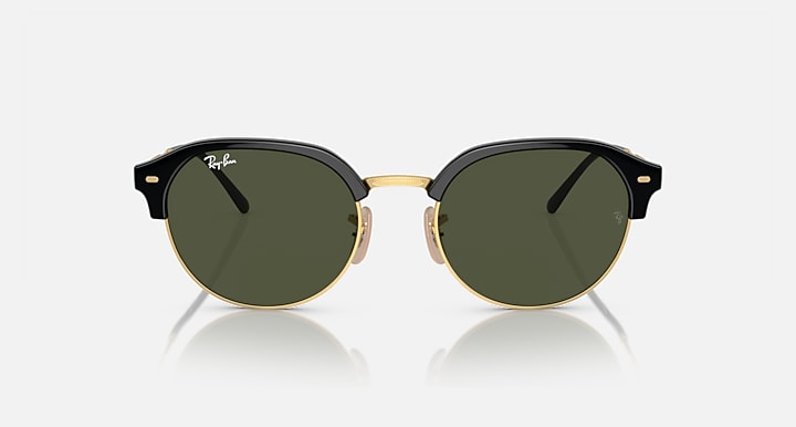 Round sunglasses with black frame and gold bridge, dark green lenses