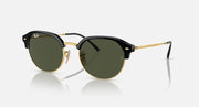 Round sunglasses with black frame, gold accents, and dark green tinted lenses