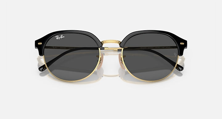 Ray-Ban RB4429 round sunglasses, black frame with gold accents and dark grey lenses