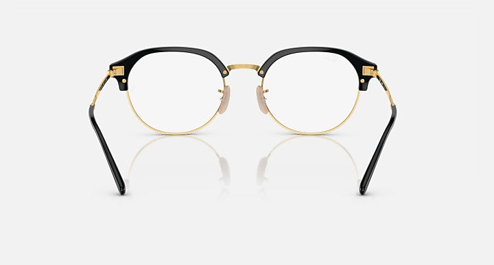 Ray-Ban RB4429 round sunglasses, black frame with gold temples and clear lenses