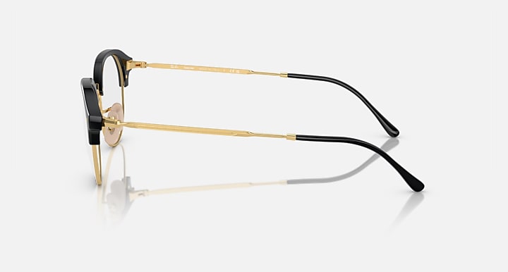 Ray-Ban RB4429 side-view sunglasses, black frame with gold metal arms and clear lenses