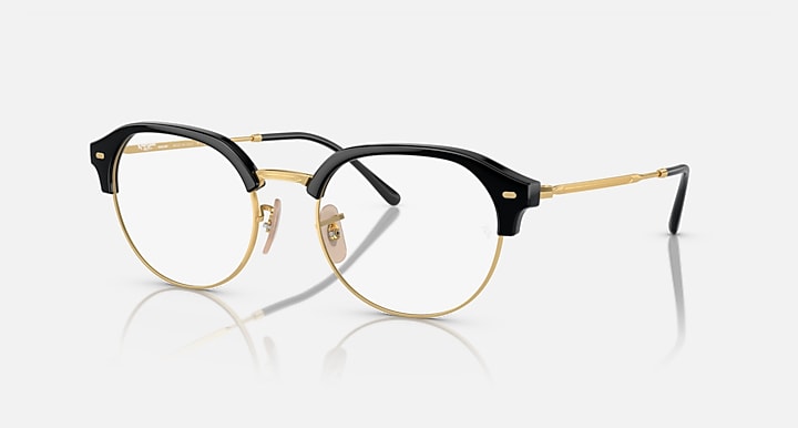 Ray-Ban RB4429 round sunglasses, black frame with gold trim and clear lenses